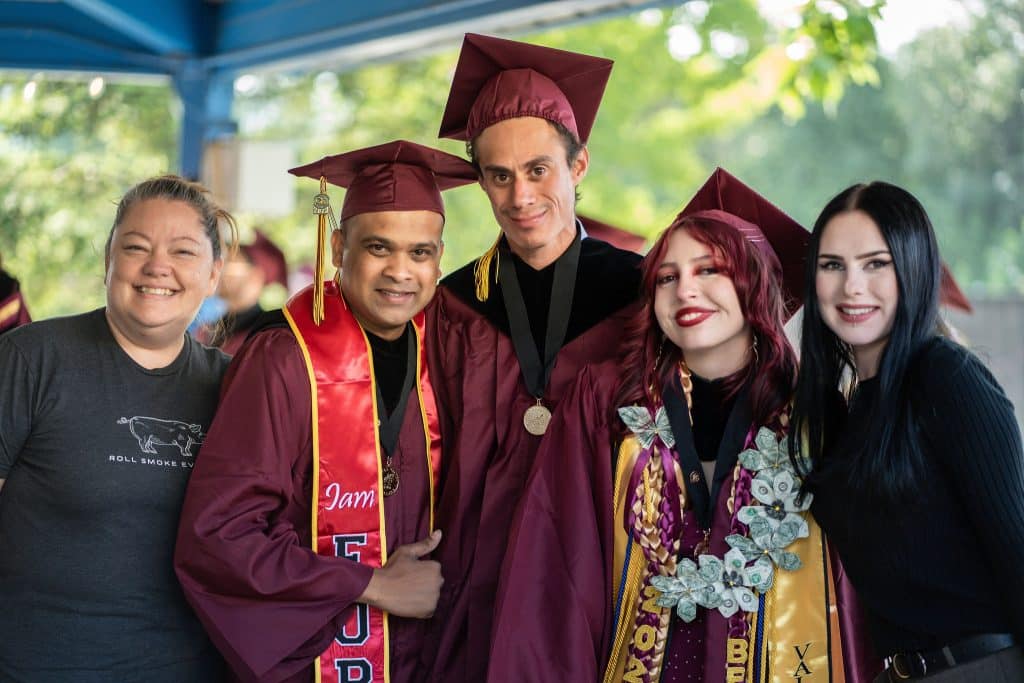 Graduates waving during the Victor Valley College graduation ceremony