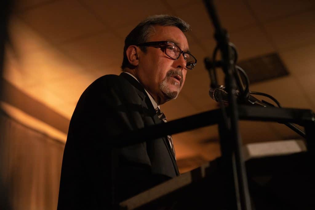 Victor Valley College Foundation Board President Fred Hunter addresses Alumni Hall of Fame attendees from the podium